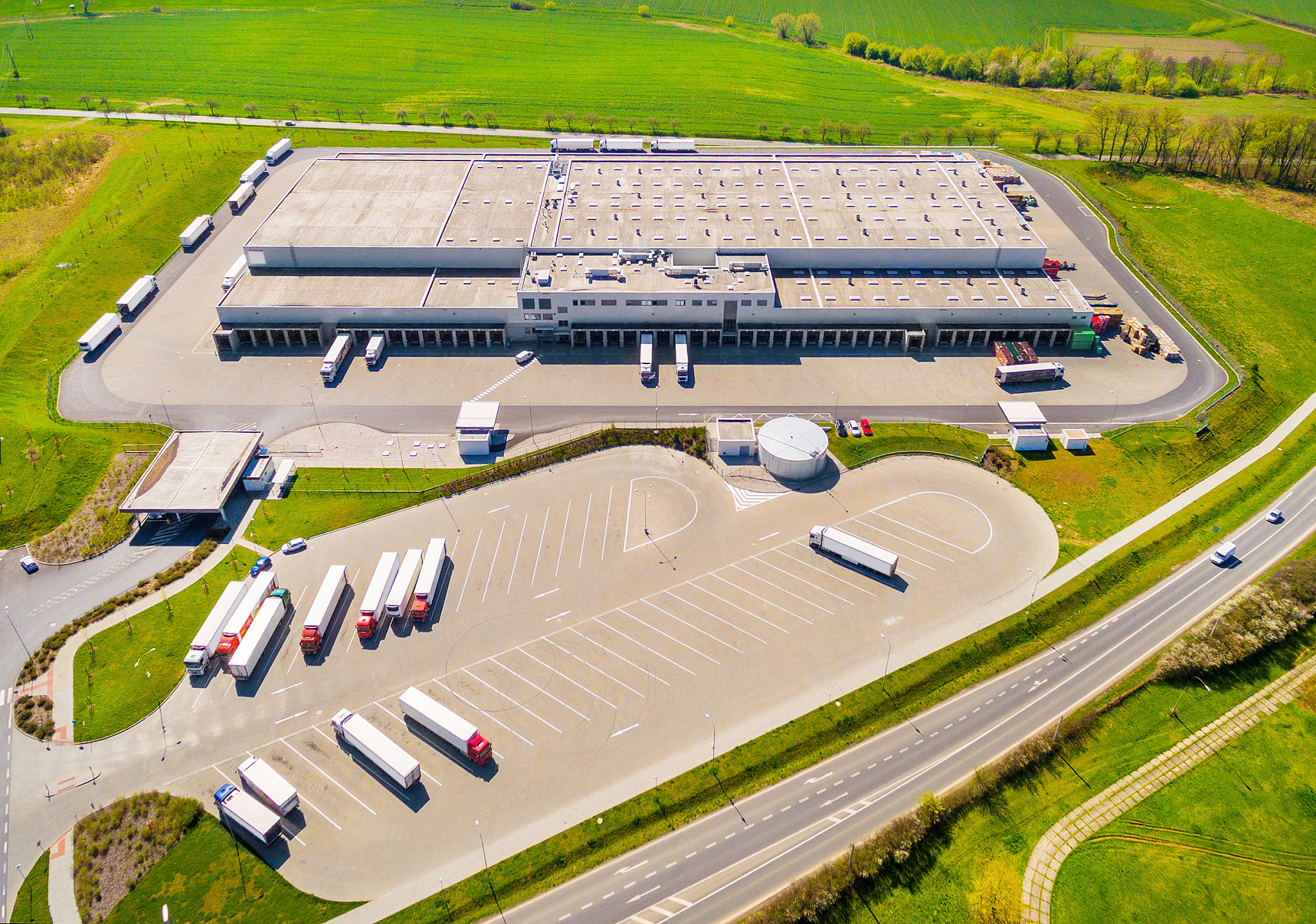 Aerial view of warehouse with trucks..jpg